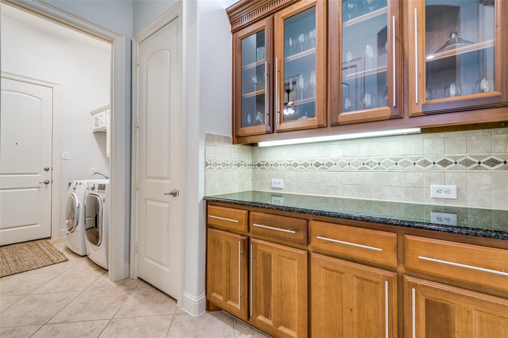8237 Inverness The Colony, TX 75056 - Photo 10 of 22 a bathroom with a sink and a washing machine