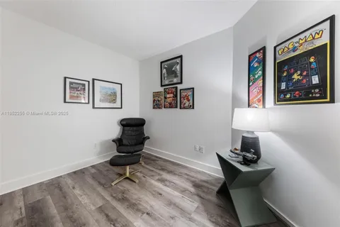 a view of a chair and tables in the balcony