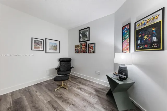 a view of a chair and tables in the balcony