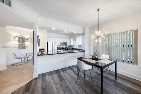 a open kitchen with stainless steel appliances granite countertop a sink a stove and refrigerator