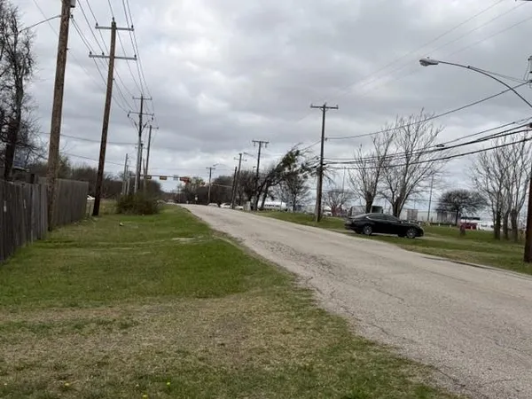 a view of a garden with a building