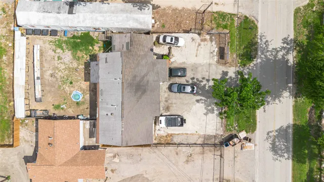 an aerial view of residential house with outdoor space and parking