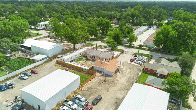 an aerial view of a house with outdoor space