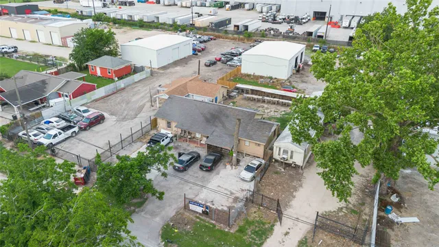 an aerial view of a houses with outdoor space