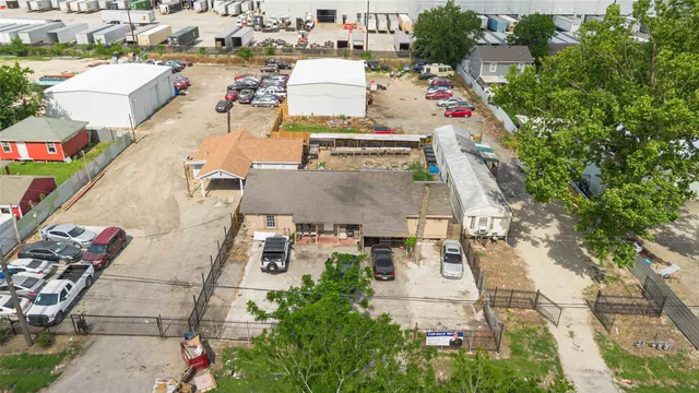 an aerial view of residential houses with outdoor space