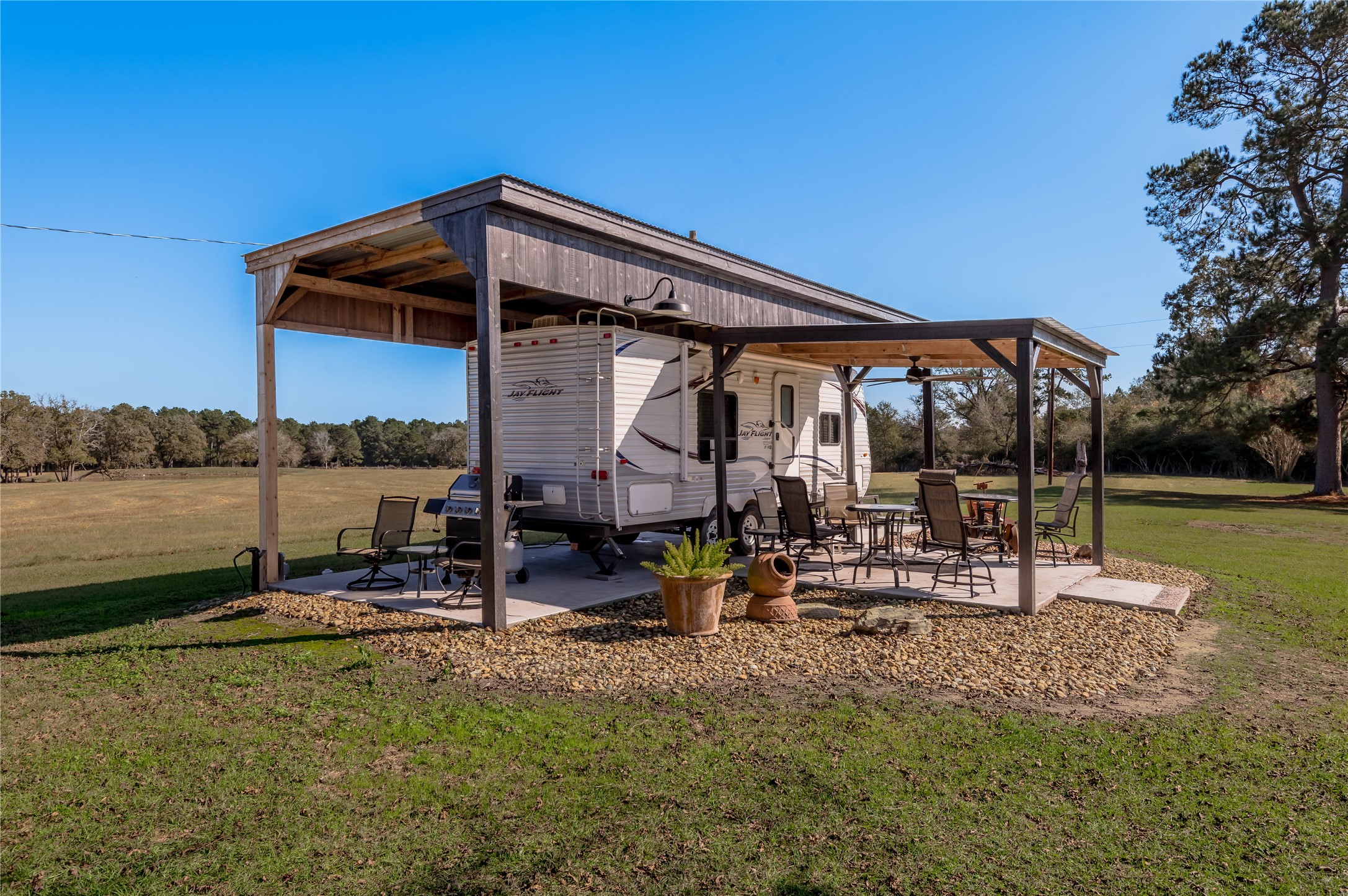 5316 Highway 19 Trinity, TX 75862 - Photo 25 of 34 a view of a house with backyard and sitting area
