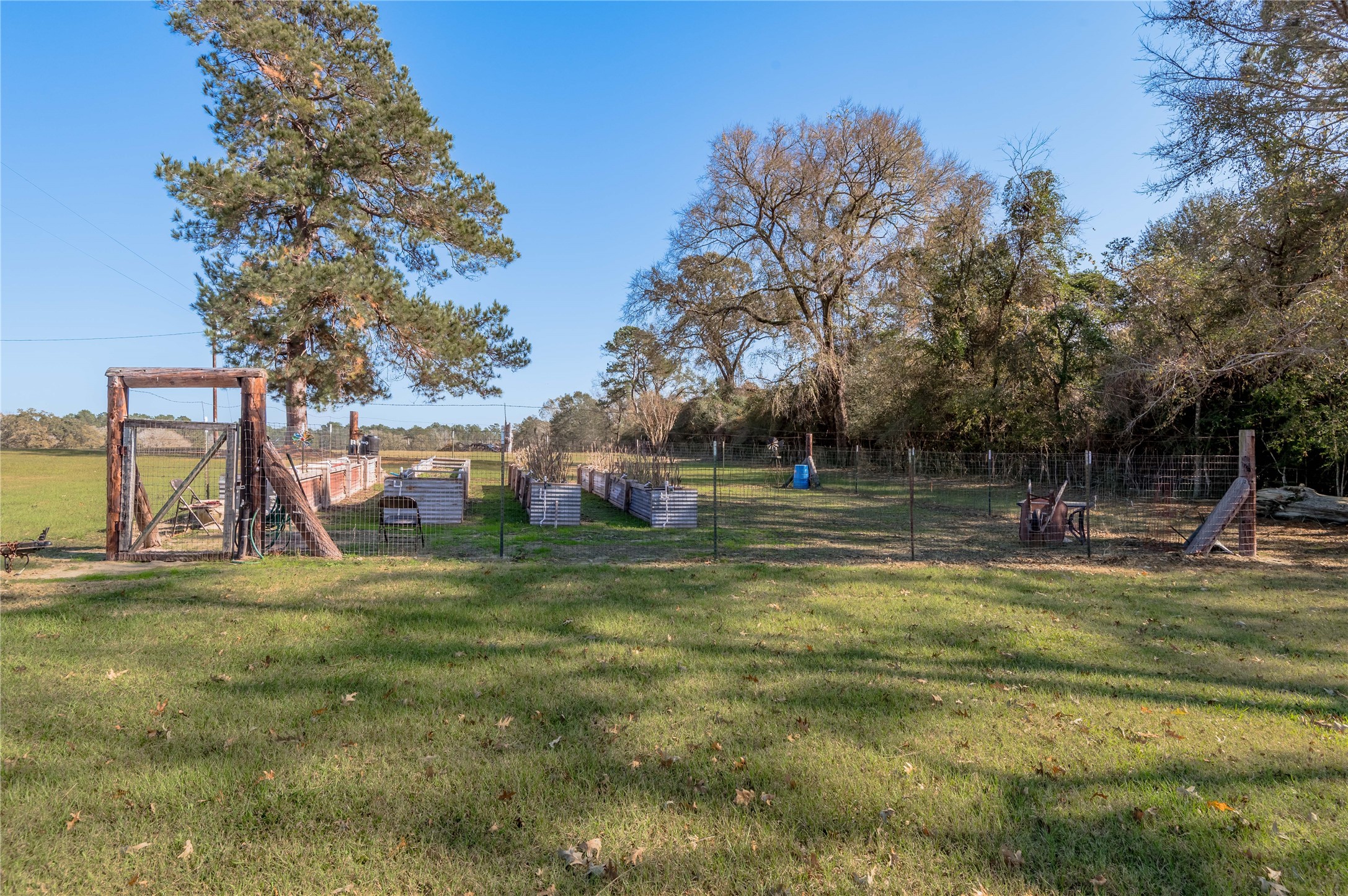 5316 Highway 19 Trinity, TX 75862 - Photo 30 of 34 a backyard of a house with table and chairs