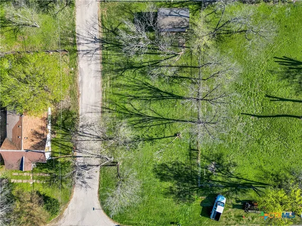 a backyard of a building with lots of green space