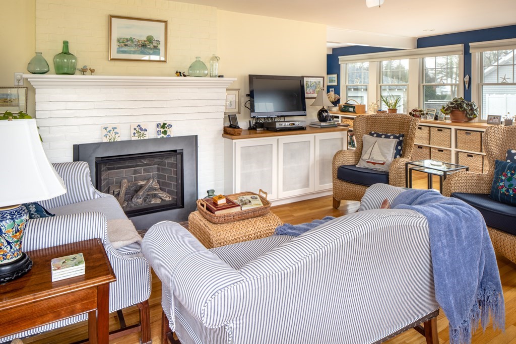 7 Mattakiset Road Mattapoisett, MA 02739 - Photo 11 of 39 a living room with furniture and a fireplace