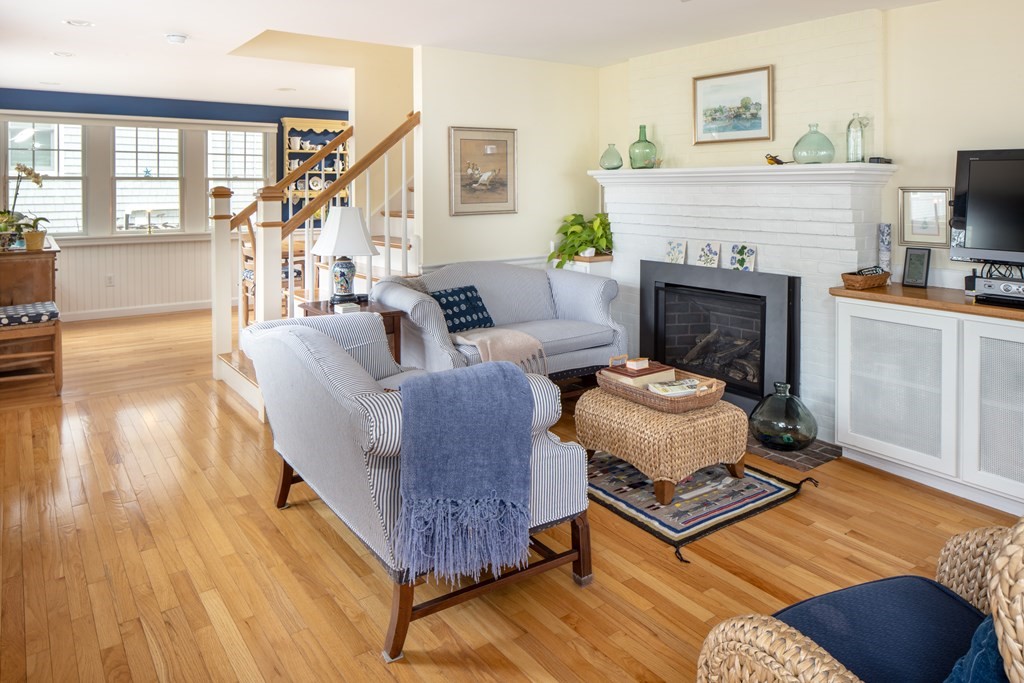7 Mattakiset Road Mattapoisett, MA 02739 - Photo 12 of 39 a living room with furniture and a fireplace
