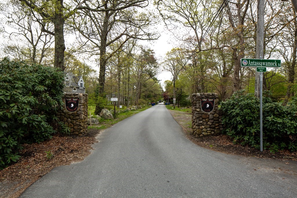7 Mattakiset Road Mattapoisett, MA 02739 - Photo 2 of 39 a view of a street with trees on both side of it