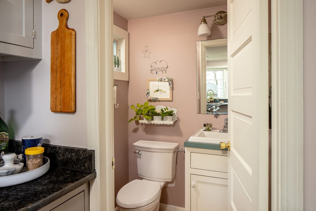 7 Mattakiset Road Mattapoisett, MA 02739 - Photo 24 of 39 a bathroom with a granite countertop toilet and a sink