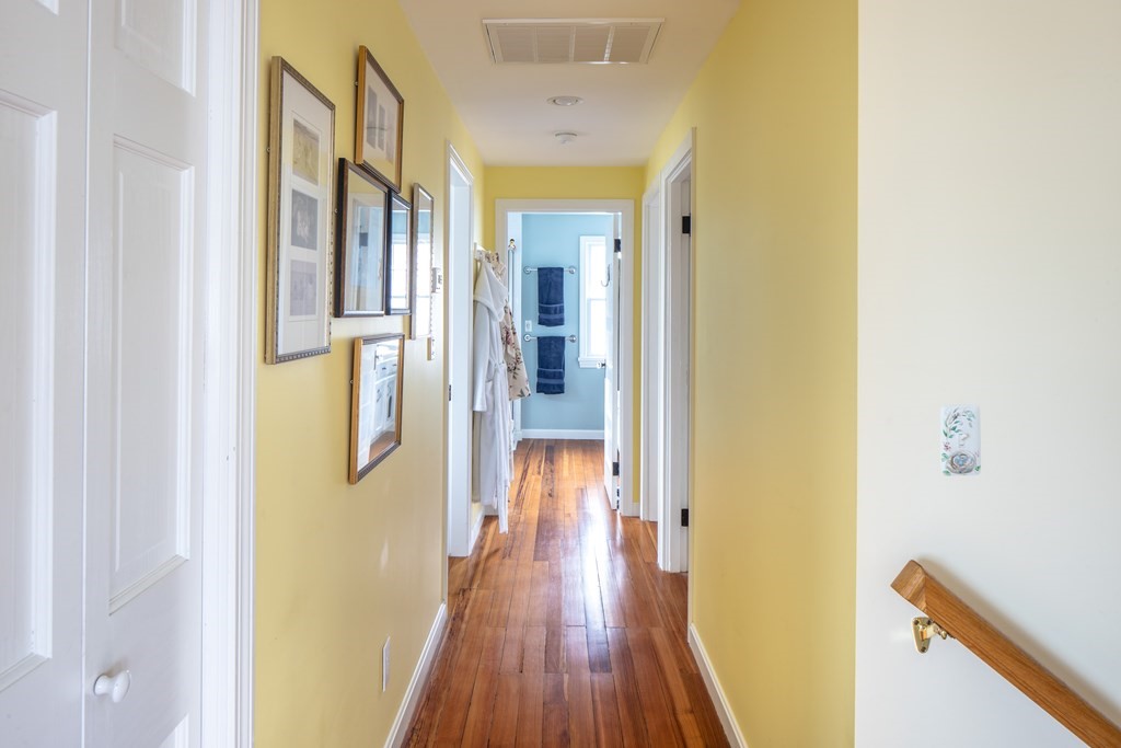 7 Mattakiset Road Mattapoisett, MA 02739 - Photo 27 of 39 a view of a hallway with wooden floor