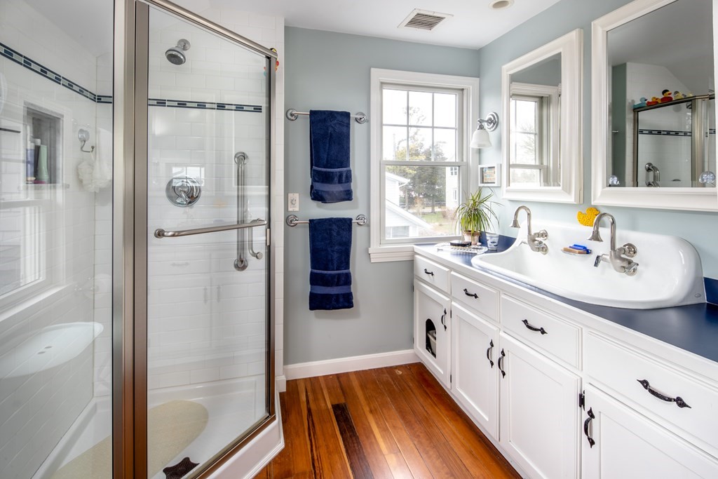 7 Mattakiset Road Mattapoisett, MA 02739 - Photo 28 of 39 a kitchen with white cabinets and refrigerator