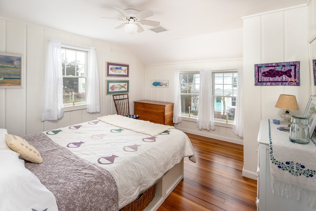 7 Mattakiset Road Mattapoisett, MA 02739 - Photo 31 of 39 a spacious bedroom with a bed and wooden floor