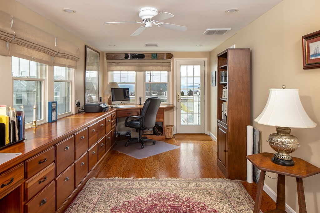 7 Mattakiset Road Mattapoisett, MA 02739 - Photo 34 of 39 a living room with furniture a flat screen tv and a large window
