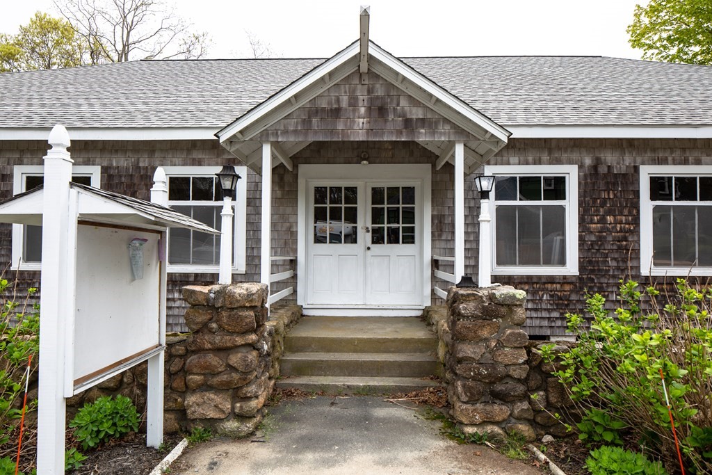 7 Mattakiset Road Mattapoisett, MA 02739 - Photo 37 of 39 front view of a house with a small yard