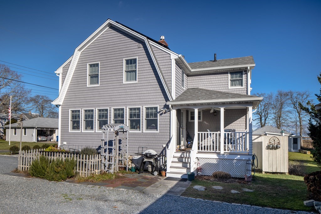 7 Mattakiset Road Mattapoisett, MA 02739 - Photo 7 of 39 a front view of a house with a yard