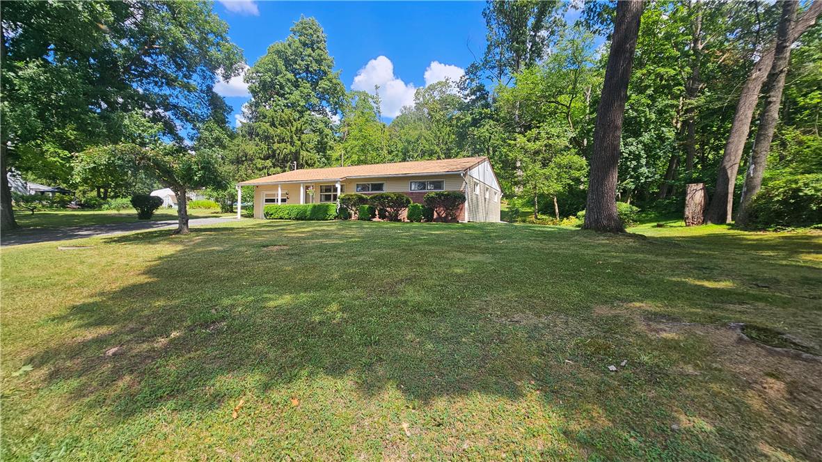 2529 Ringhoffer Road Hellertown, PA 18055 - Photo 17 of 33 Mature trees frame this charming ranch home with a well-maintained lawn.