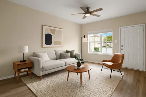 a living room with furniture and a window