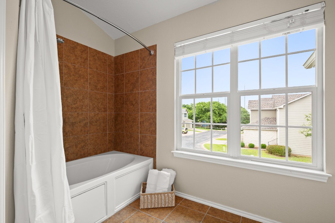 2632 Century Park Boulevard, Unit 34 Austin, TX 78727 - Photo 12 of 16 a bathroom with a bathtub and a shower