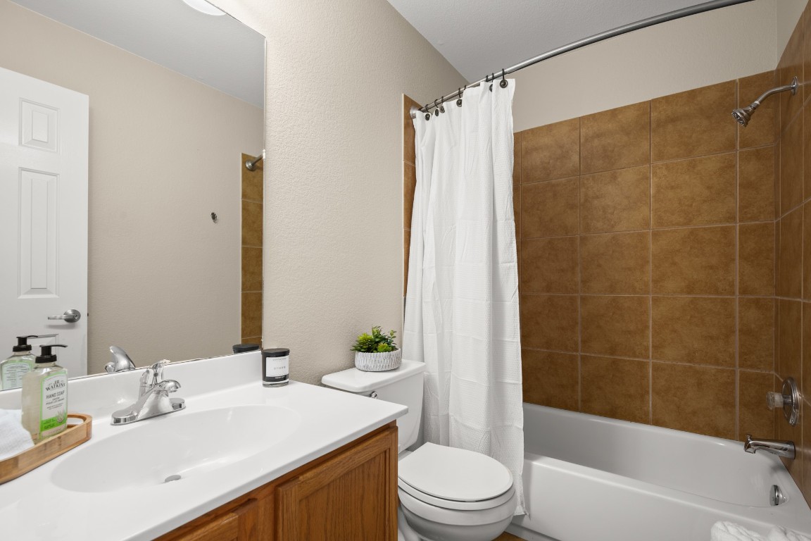 2632 Century Park Boulevard, Unit 34 Austin, TX 78727 - Photo 13 of 16 a bathroom with a sink a toilet and shower