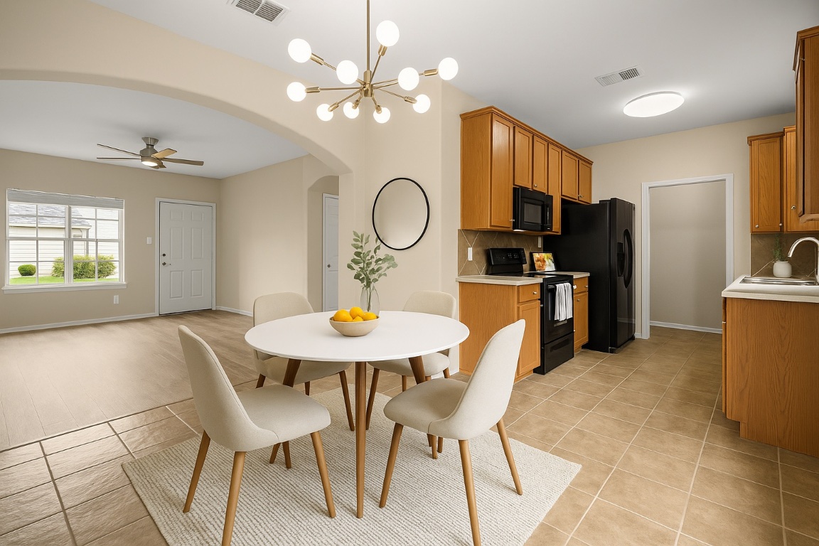 2632 Century Park Boulevard, Unit 34 Austin, TX 78727 - Photo 5 of 16 a view of a dining room with furniture and a chandelier fan