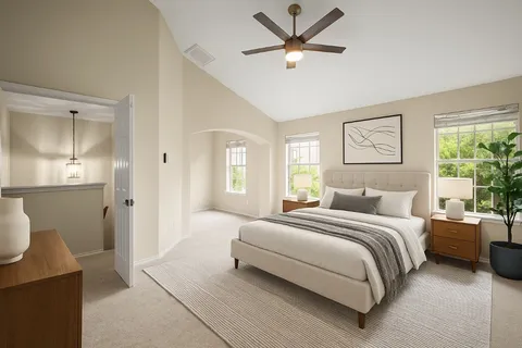 an empty room with windows and entrance