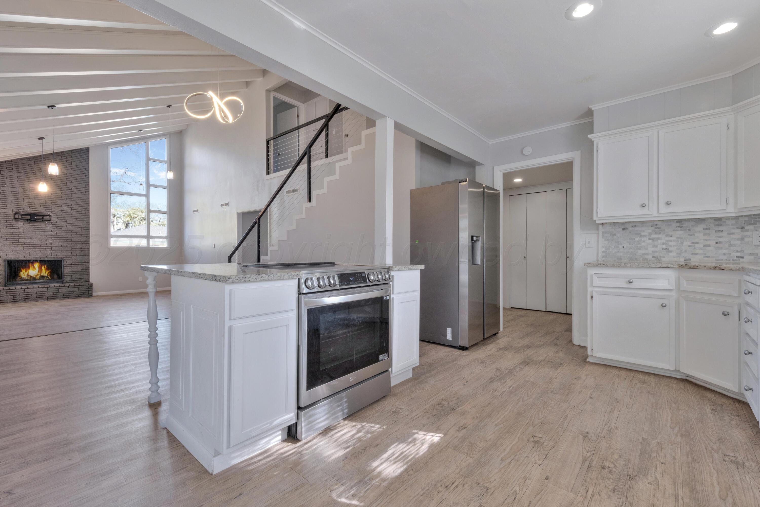 3700 Paramount Boulevard Amarillo, TX 79109 - Photo 12 of 43 a kitchen with cabinets and stainless steel appliances