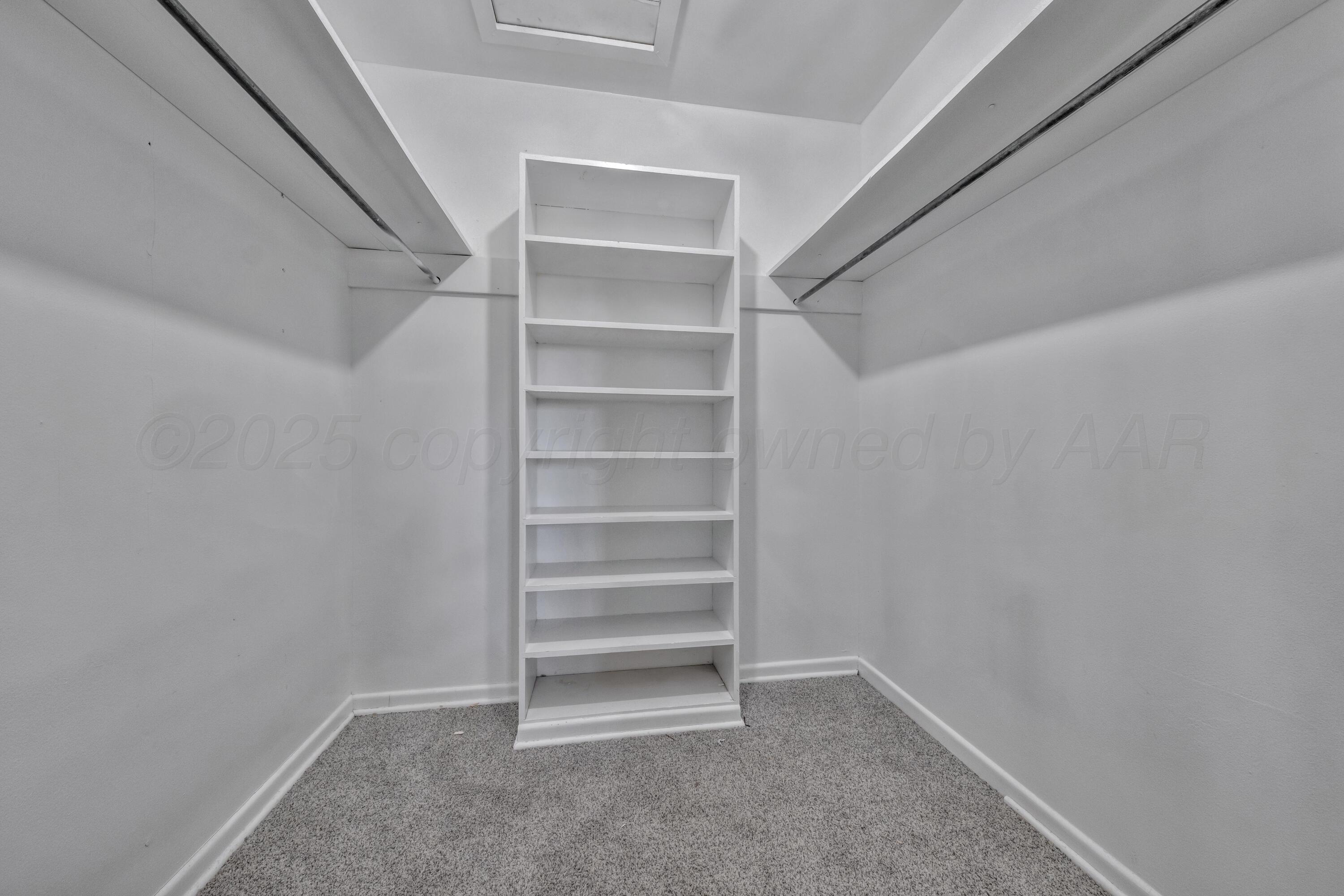 3700 Paramount Boulevard Amarillo, TX 79109 - Photo 27 of 43 a view of walk in closet with empty racks