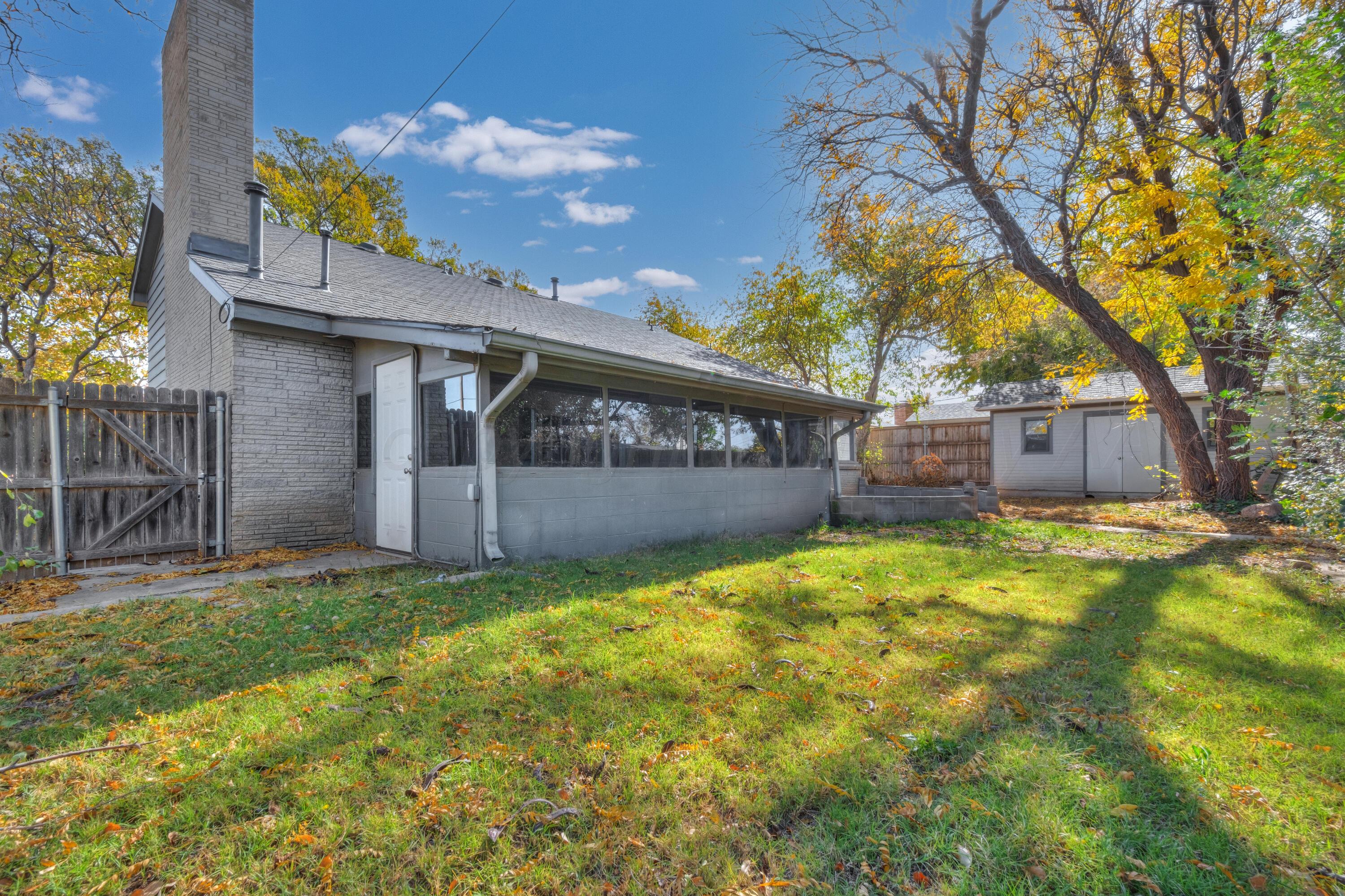 3700 Paramount Boulevard Amarillo, TX 79109 - Photo 36 of 43 a view of a house with a yard garage and outdoor seating