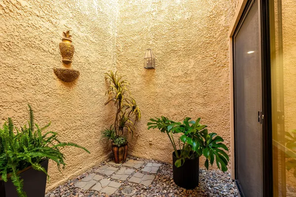 a bedroom with a bed and a painting on the wall