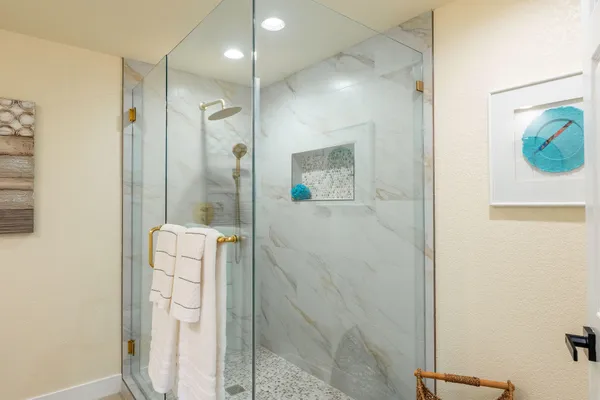 a backyard of a house with a garden and outdoor seating