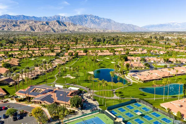 an aerial view of a golf course with outdoor space