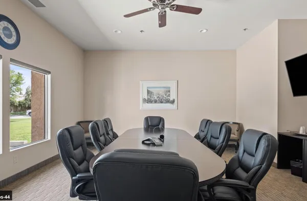 a group of people sitting on tables in a room