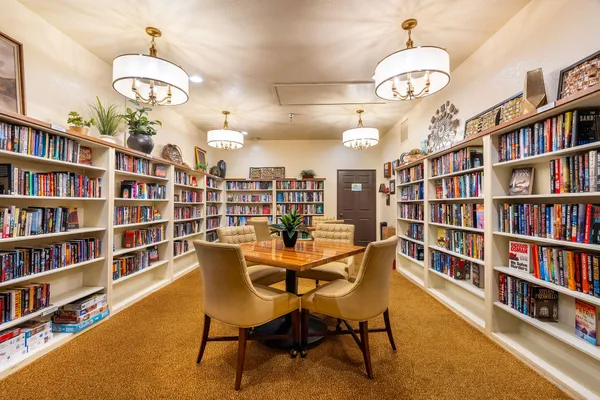 a outdoor space with lots of tables a garden view and chairs