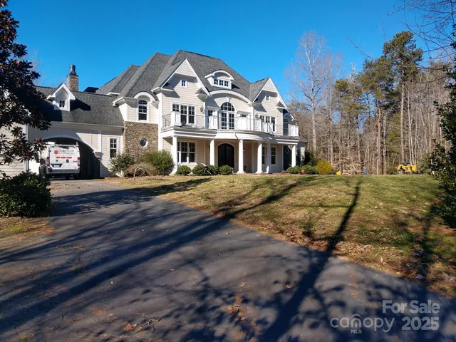 a front view of a building with a yard
