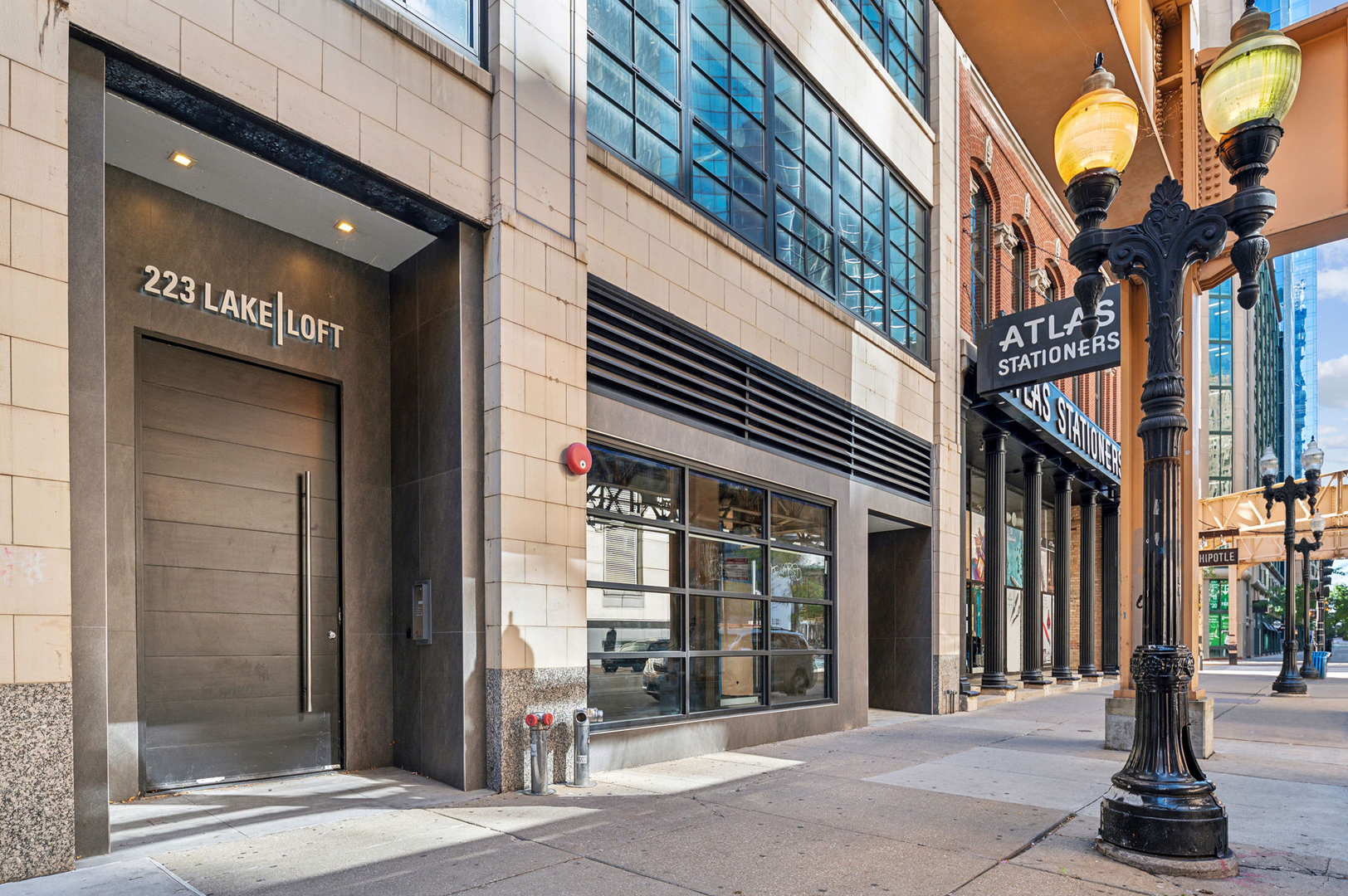 223 West Lake Street, Unit PH5S Chicago, IL 60606 - Photo 1 of 32 a front view of a building with a glass door