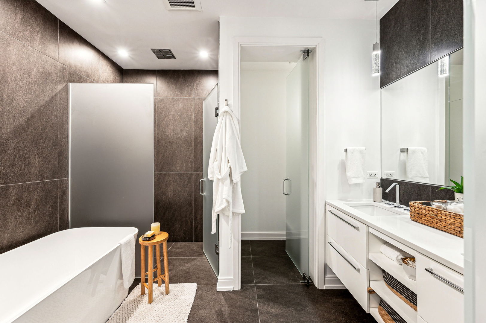 223 West Lake Street, Unit PH5S Chicago, IL 60606 - Photo 18 of 32 a bathroom with a double vanity sink a toilet and shower