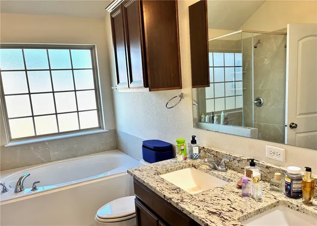 a bedroom with bed and window