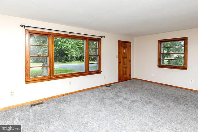 a bedroom with a bed and a potted plant