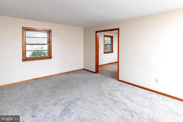 an empty room that has a window