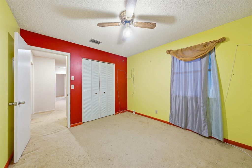 3091 Venice Way Miramar, FL 33025 - Photo 18 of 27 a view of a livingroom with a chandelier fan and a dresser