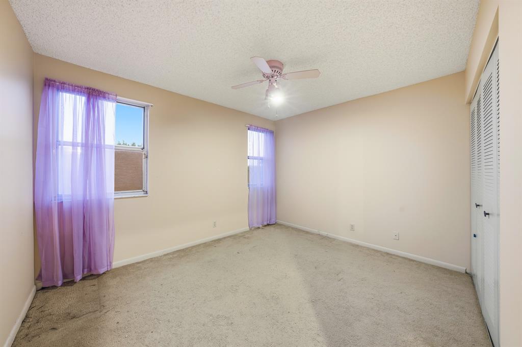 3091 Venice Way Miramar, FL 33025 - Photo 20 of 27 an empty room with a ceiling fan and a window