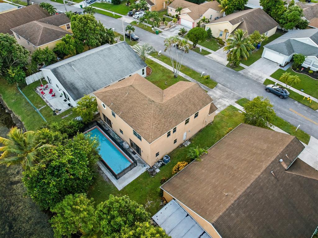 3091 Venice Way Miramar, FL 33025 - Photo 6 of 27 an aerial view of a house with a yard and lake