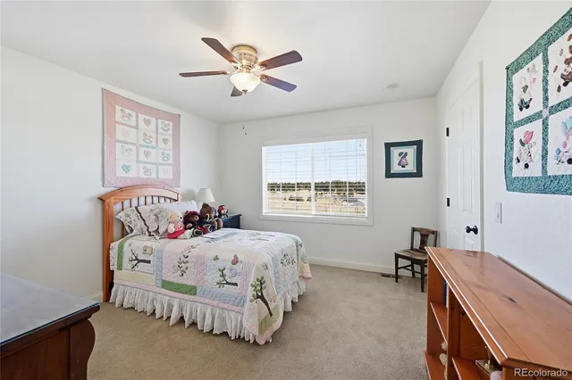 a bedroom with a bed and a table in it