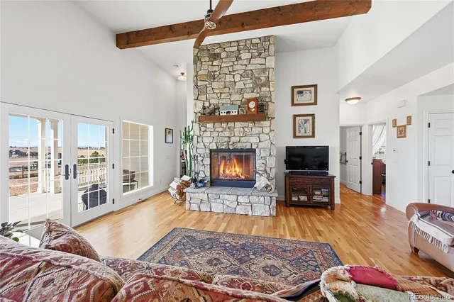 a living room with furniture rug and a fireplace