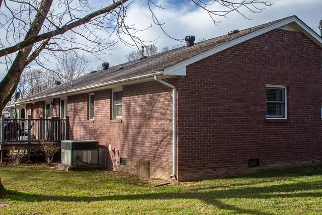 a backyard of a house with lots of trees