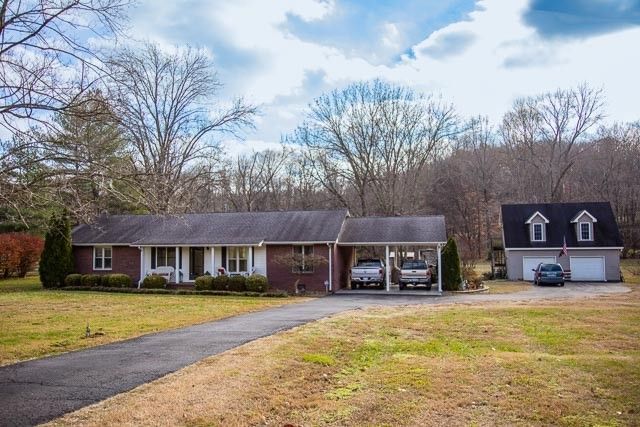 a white toilet sitting next to a shower curtain