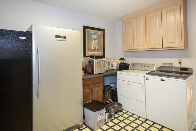 a bedroom with a bed and a tv on the dresser